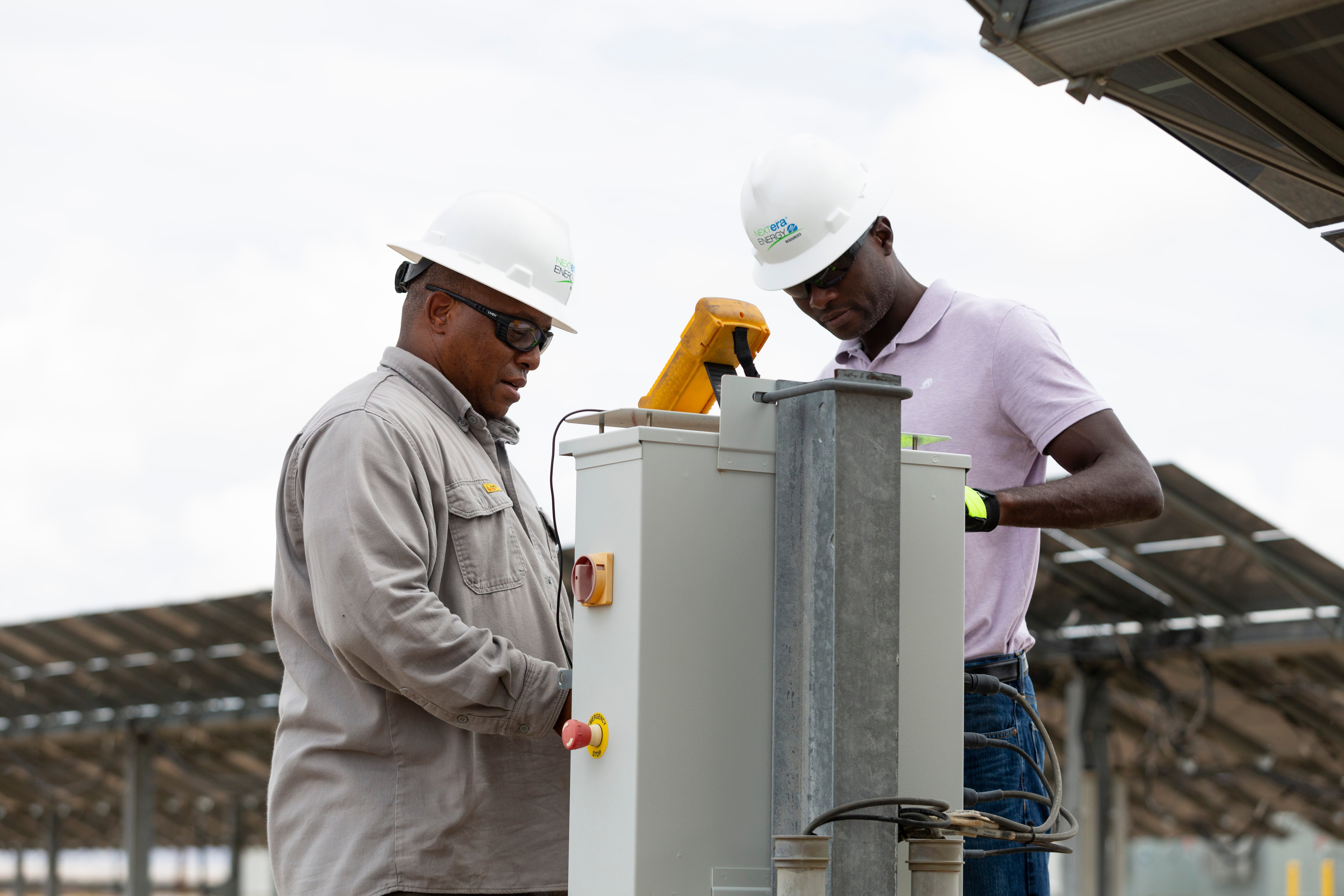 solar techs on solar farm