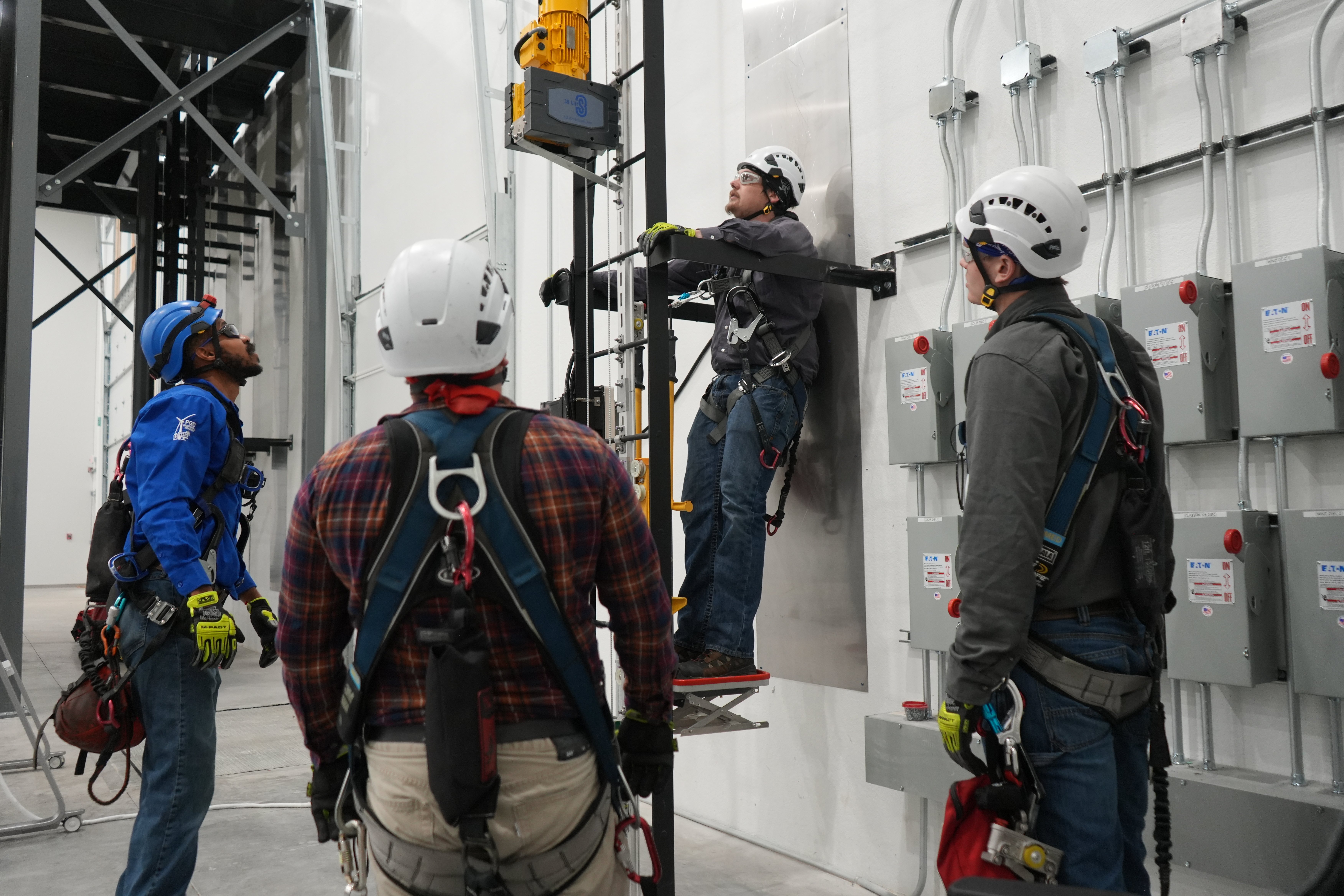 trainees in harnesses for rescue training